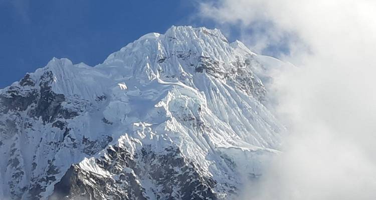 Close-up of a snow-covered mountain peak.