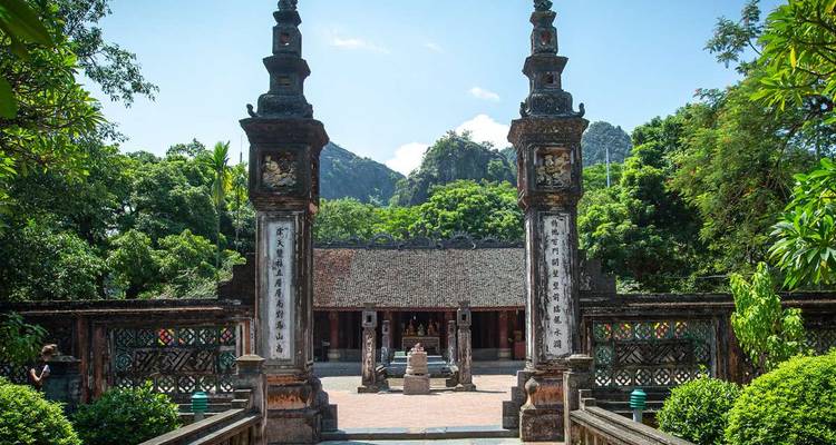 Ancient entrance with two tall, decorated pillars.