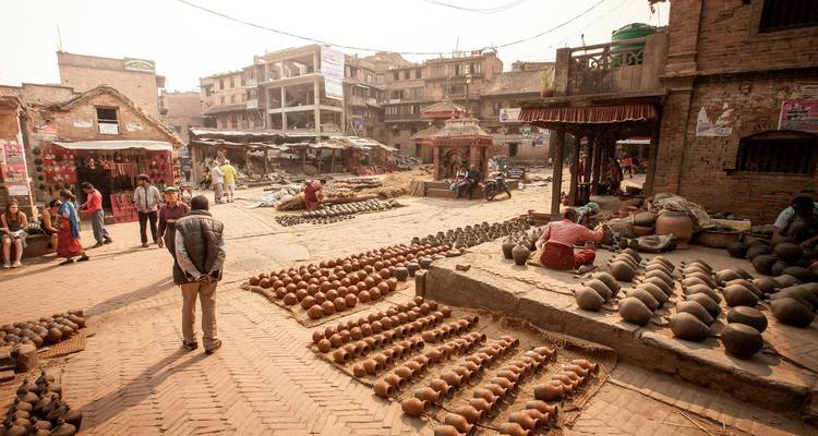 Pottery square with clay pots and people in a historic area