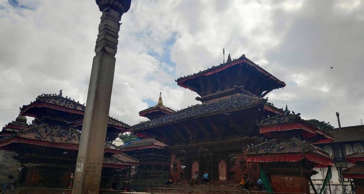 Temple with a tiered roof and cloudy sky