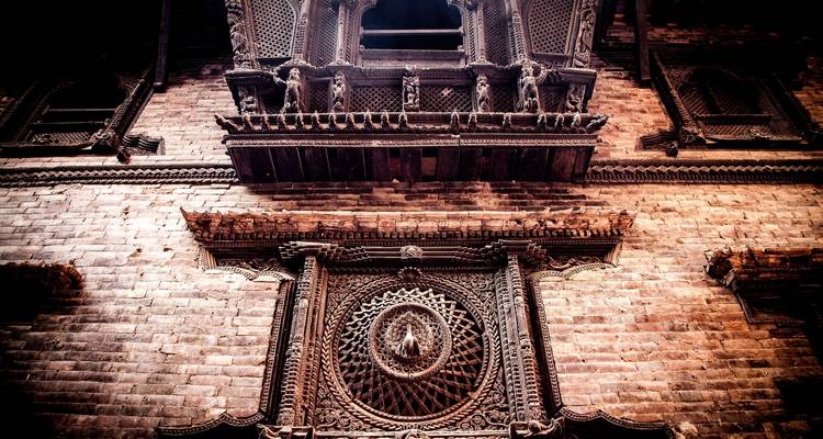 Intricate wooden carvings and architecture on a historic building facade