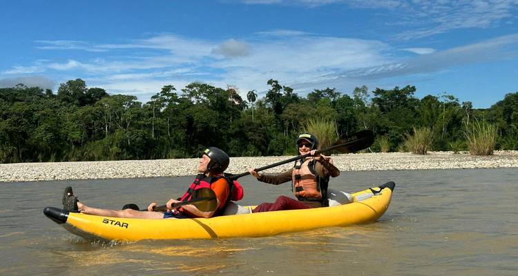 People kayaking on a river enjoying their time.