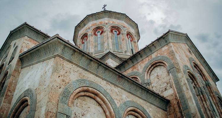 Close-up view of a detailed stone church facade.