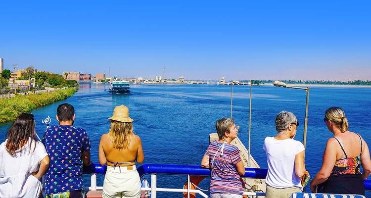 Tourists enjoying a river cruise.