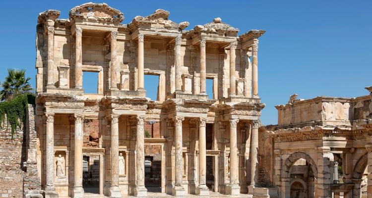 Ancient library ruins with clear sky background.