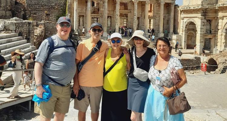 Group posing in front of ancient ruins.