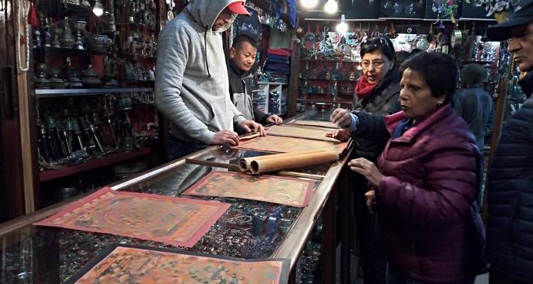 People exploring a market with traditional goods