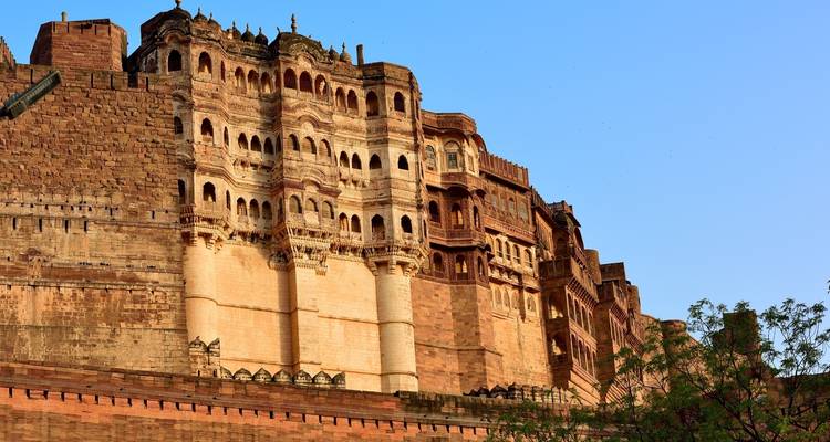 Massive Mehrangarh Fort under a clear blue sky.