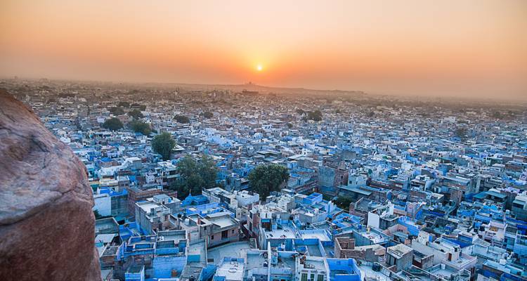 Aerial view of Jodhpur city at sunset with blue houses.