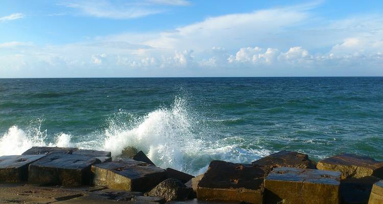 Waves crashing against the rocky shore.