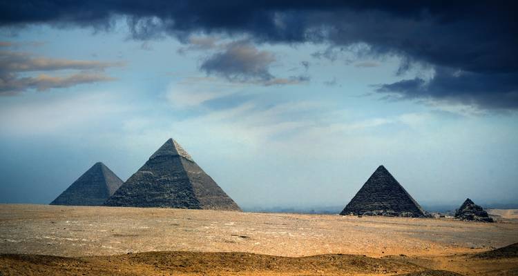 Breathtaking view of the pyramids under a dramatic sky.