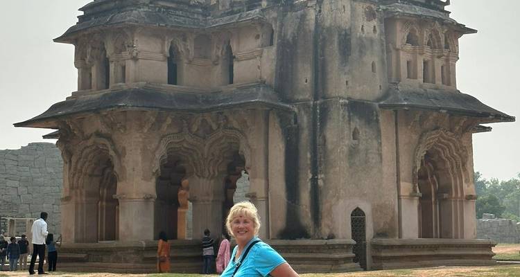 A woman in front of a unique historical building.