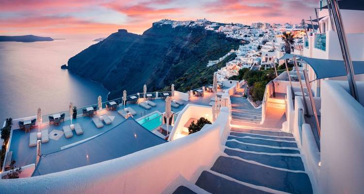 Santorini at sunset with a scenic view over the sea.