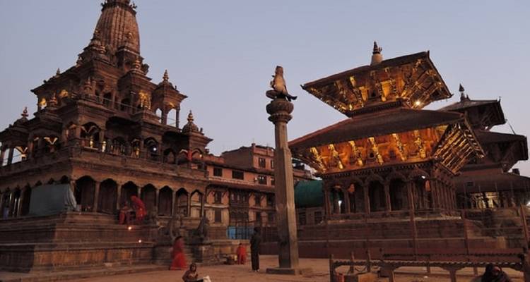 Illuminated temples in Kathmandu during dusk.
