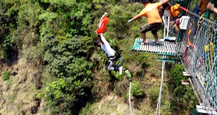 A person jumping off a bungee platform.