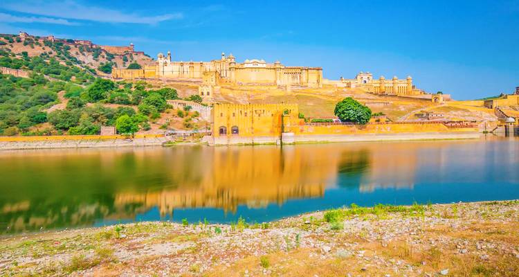Amber Fort reflected in water in Jaipur.