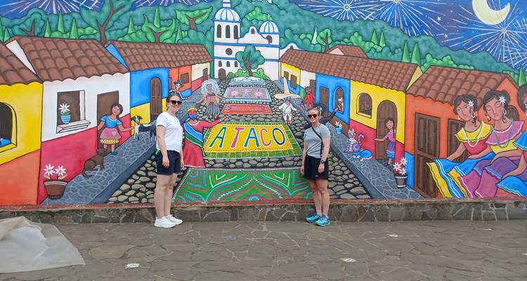 Mural portraying a vibrant street scene with people.