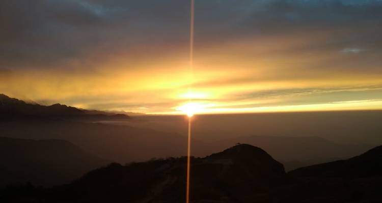 Colorful sunrise over distant mountains.