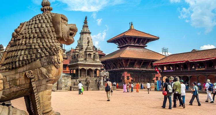 Historic square with ancient temples and tourists.