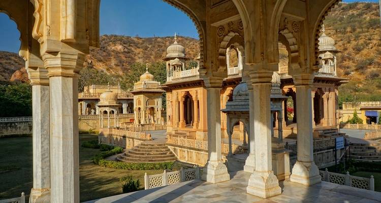 Temple complex with marble structures and gardens.