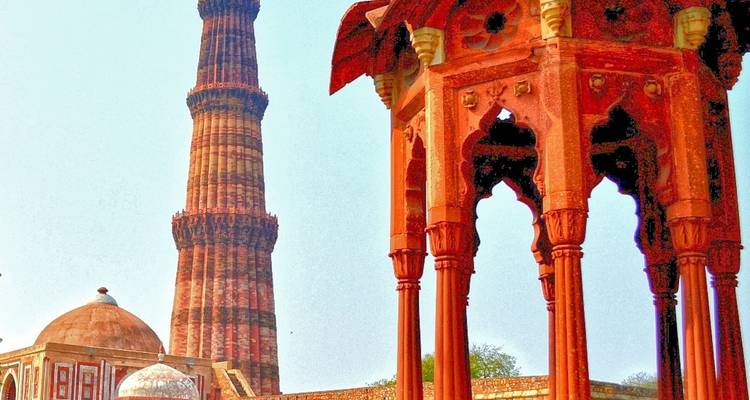 Qutub Minar with temple complex and vibrant colors.
