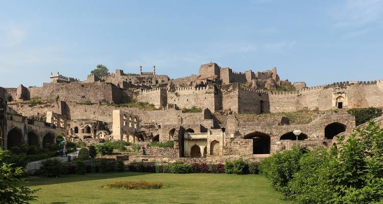 Expansive historic fort with ancient stone walls and gardens.