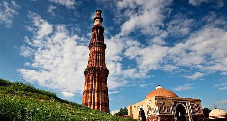 Tall historical tower with adjacent mosque