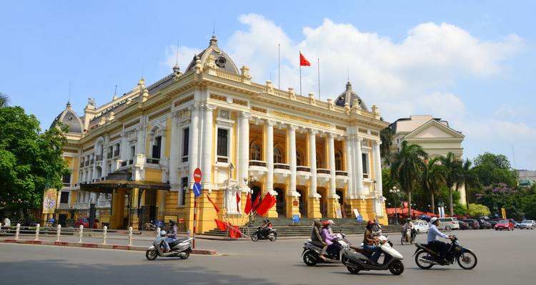 Hanoi Opera House with people and vehicles around.