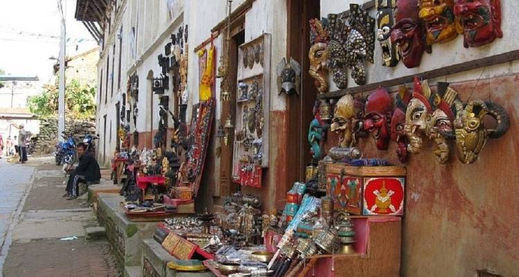 Street market with colorful masks and crafts.