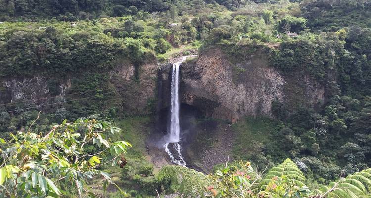 Tall waterfall cascading down a rocky cliff.