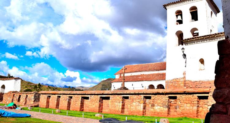 Church with stone walls and a bell tower.