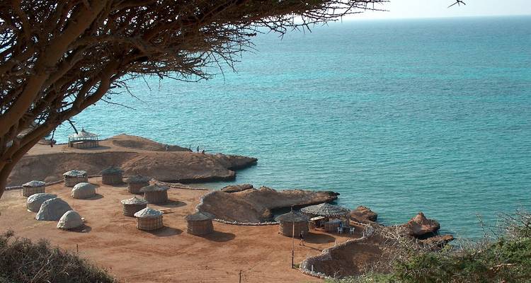 Scenic coastal view with traditional huts.