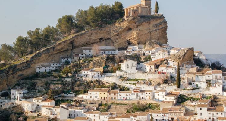 Scenic hilltop village with ancient stone buildings.