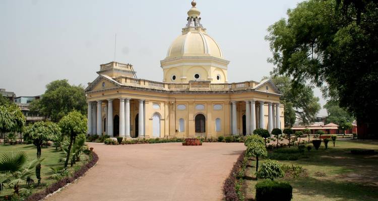 Historic dome-shaped building with gardens.