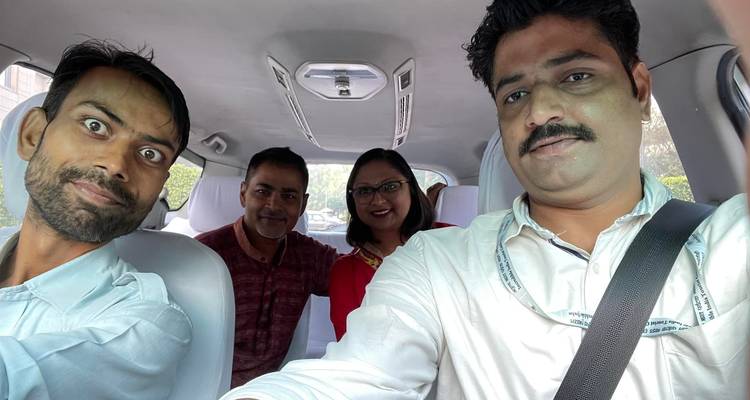 Selfie of four people in a car.