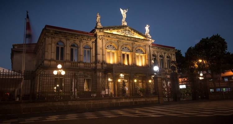 The National Theatre of Costa Rica beautifully illuminated at night.