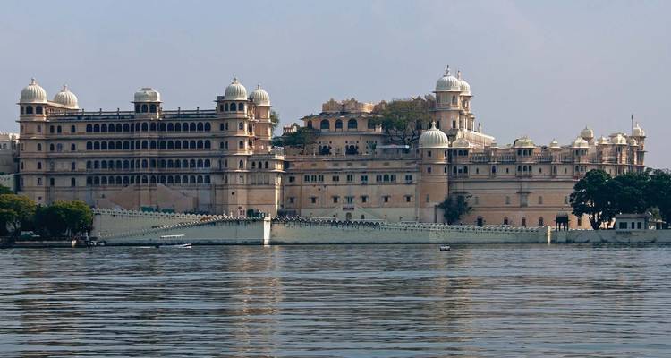 The City Palace, grand and overlooking a lake.