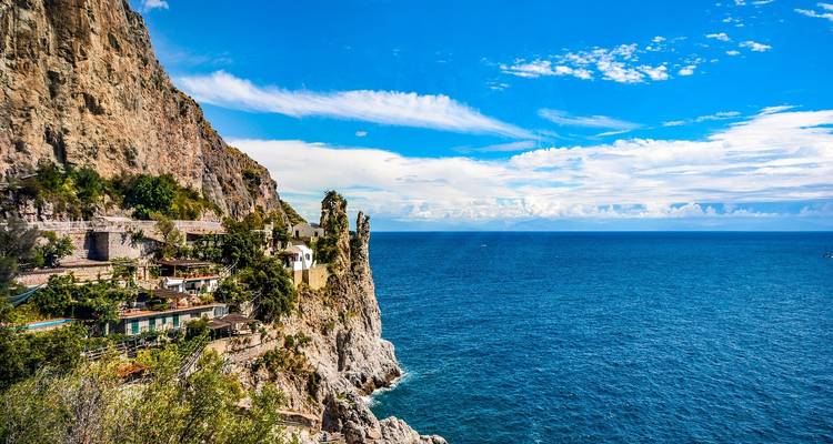 Coastal scenic view with cliffs and blue sea.