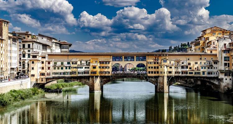 Famous Ponte Vecchio bridge in Florence with numerous shops.
