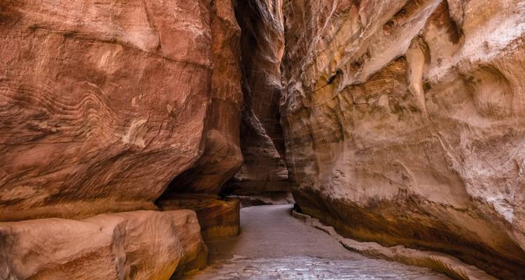 Narrow canyon with high rock walls.