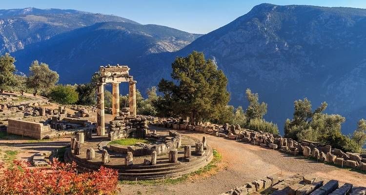 Ancient ruins of Delphi with mountains in the background in Greece.