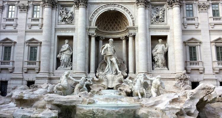 Trevi Fountain with sculptures and water.