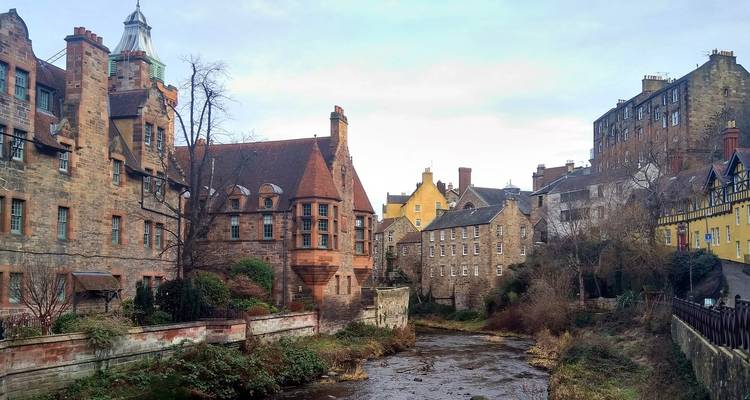 Scenic view of a river and old buildings in Edinburgh.