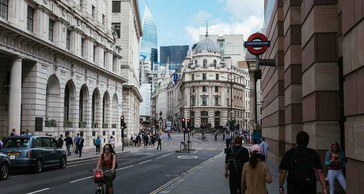 Bustling street scene in London with classic architecture.