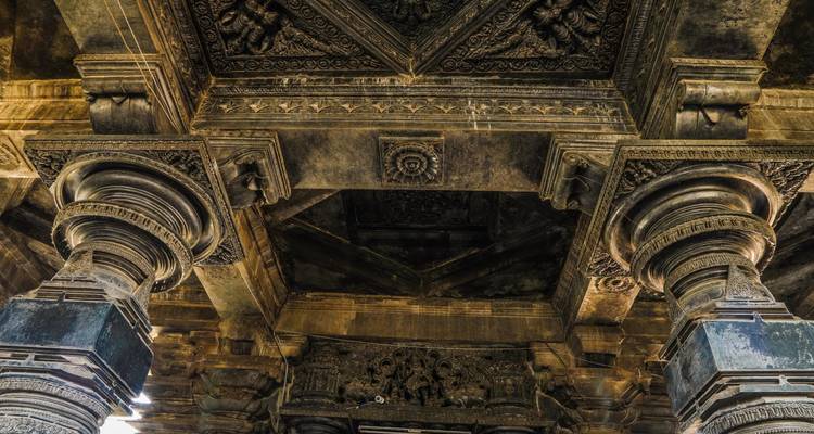 Intricately carved ceiling of an ancient structure.