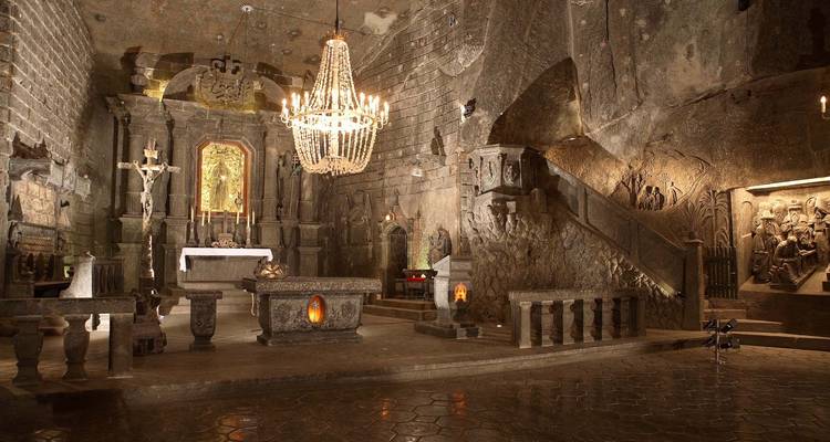 Historic chapel interior carved from salt with chandeliers.