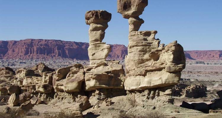 Unique rock formations under a clear sky.