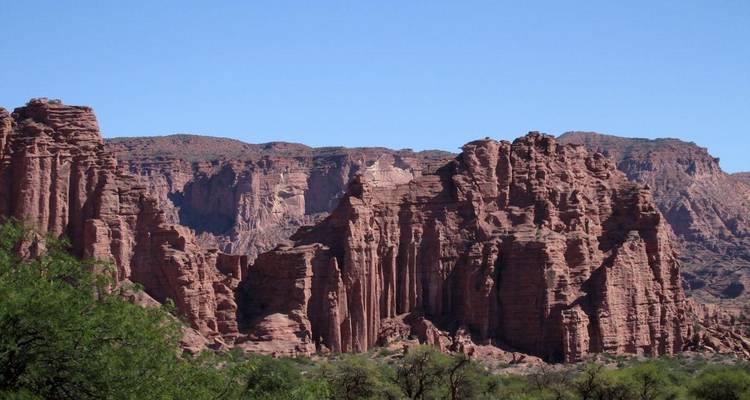 Dramatic red rock formations and cliffs.