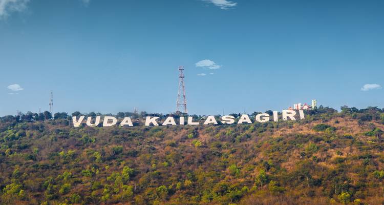 A hillside with large white lettering spelling 'VUDA Kailasagiri'.