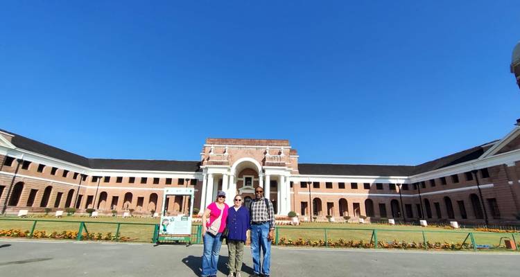 People standing in front of an official-looking building.